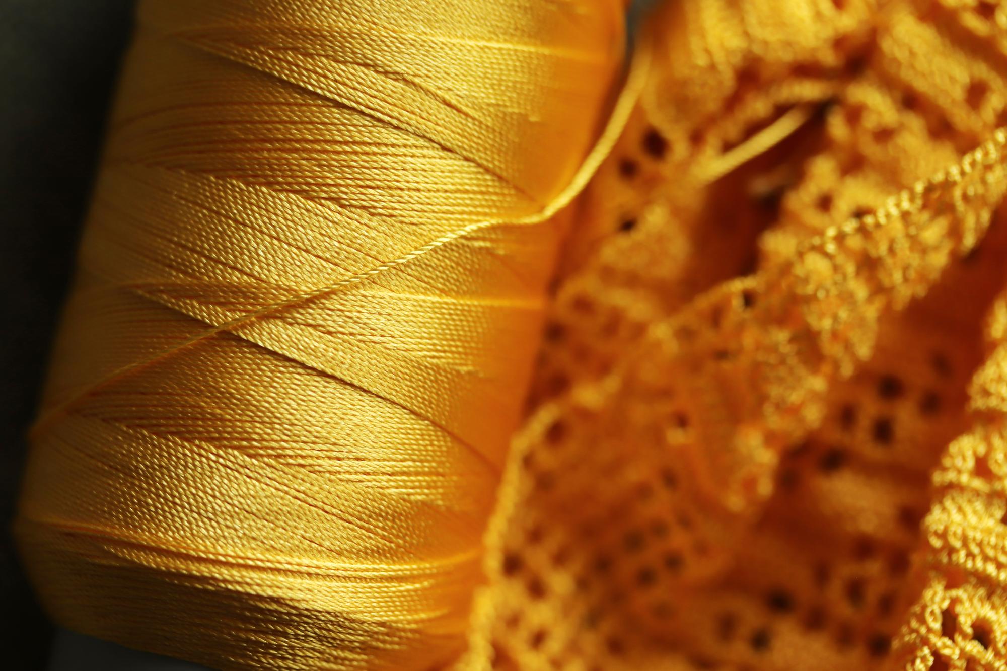 artisanal gold-thread embroidery on silk